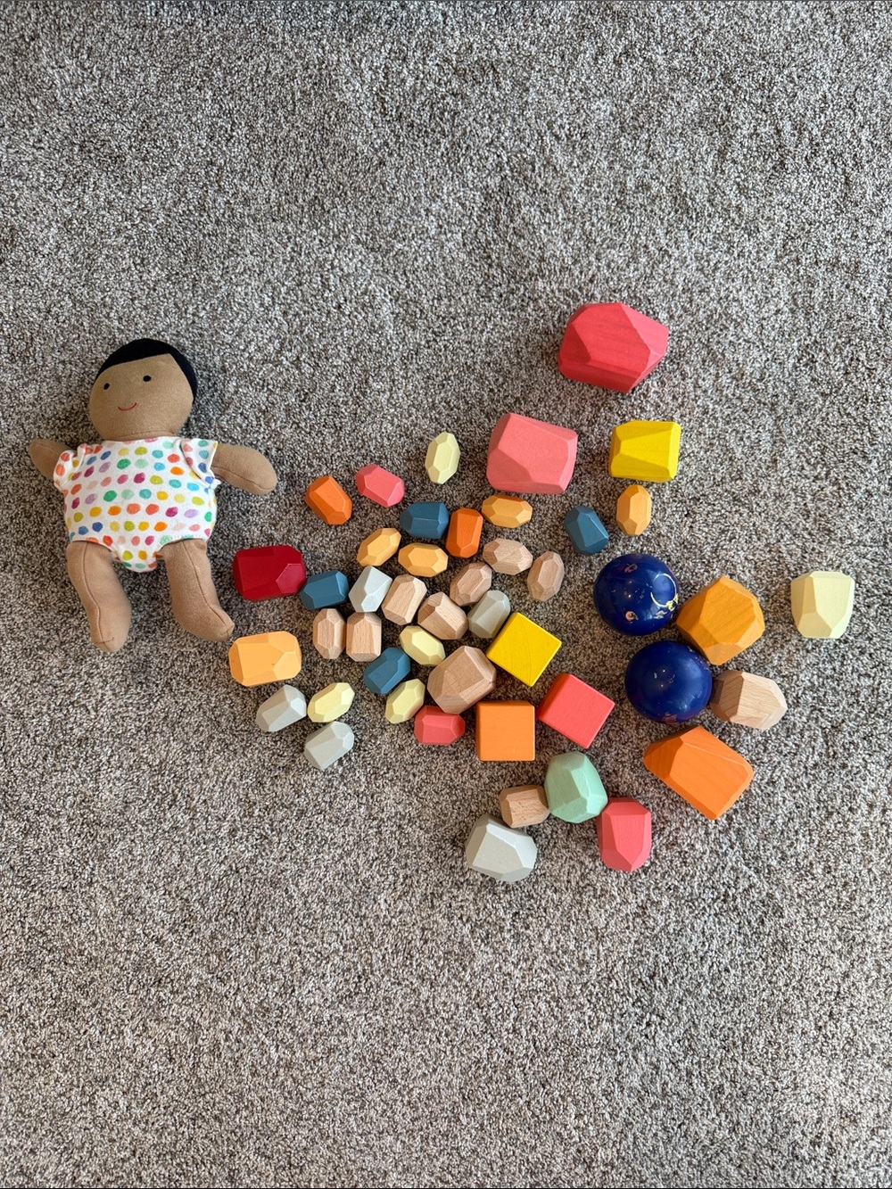 Lovevery bundle of Colorful Wooden Stacking Blocks, Light & Heavy Balls & Doll